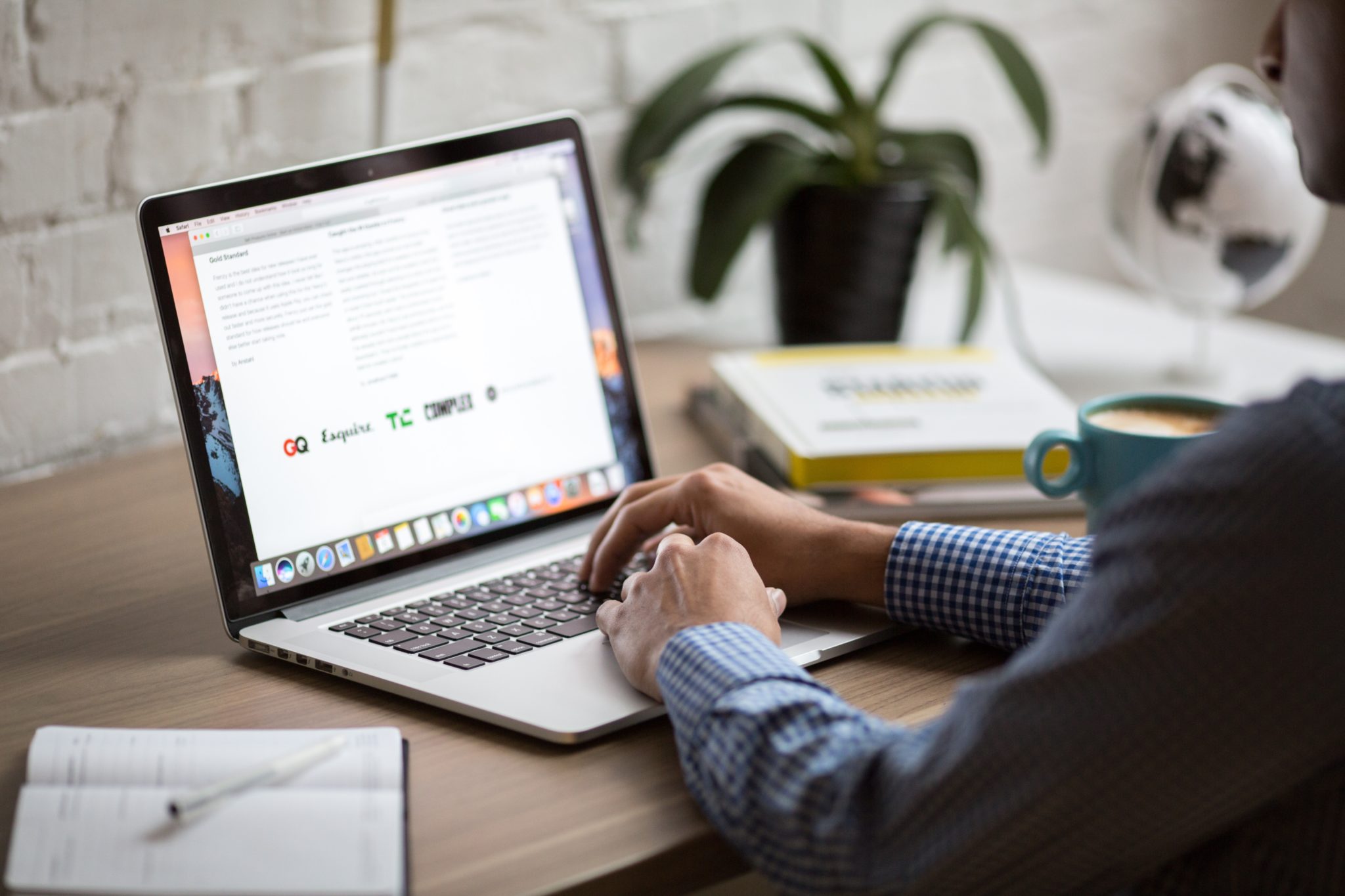 man using laptop at desk