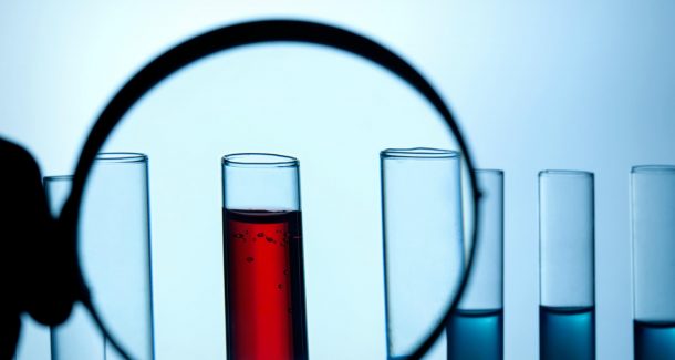 Test tube and magnifying glass