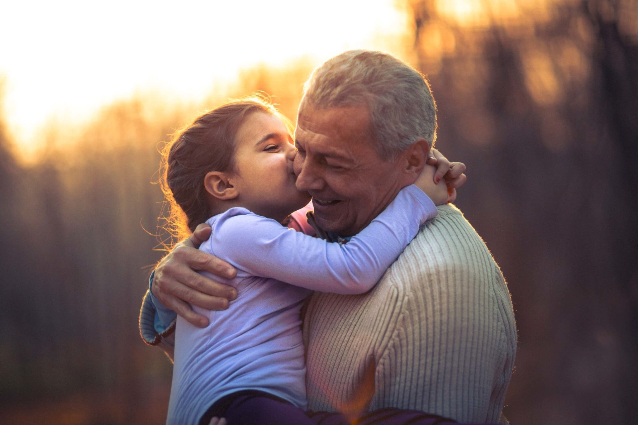 grandpa playing with granddaughter at sunset Foundat pic