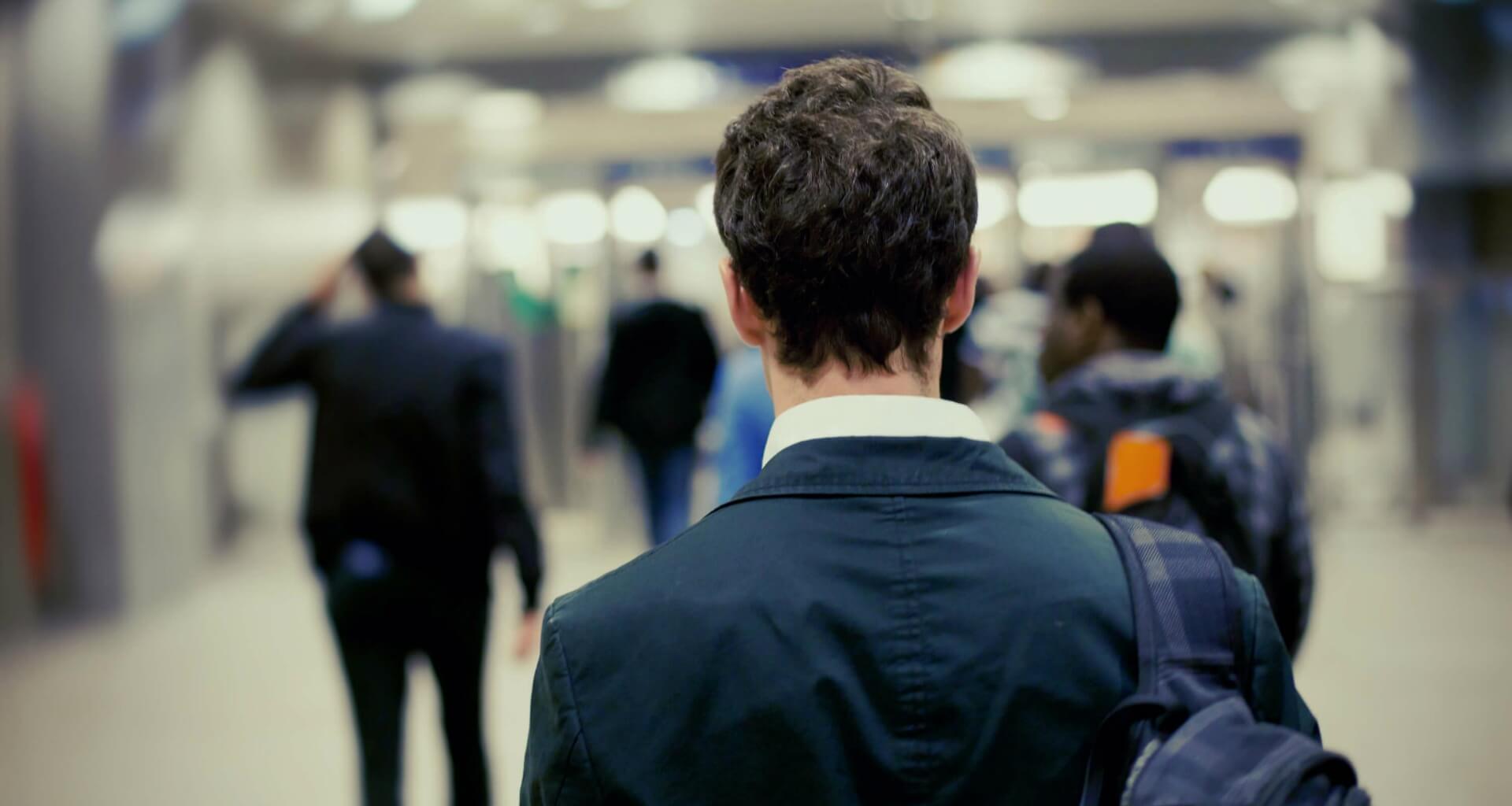 man in suit with backpack